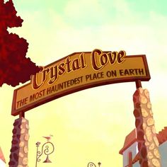 a sign that says crystal cove the most haunted place on earth in front of a tree