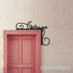 a pink door with the word garage above it