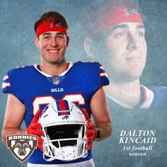 a football player is holding a helmet in front of a poster with the image of him