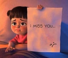 a child holding up a sign that says i miss you