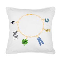 a white pillow with an image of a chain and charms on it, along with the words u to go