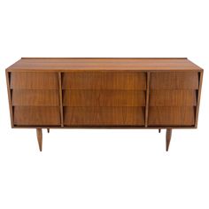 the sideboard is made out of wood and has three drawers on each side, one with