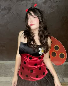 a woman dressed in a lady bug costume