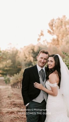 a bride and groom pose for a wedding photo