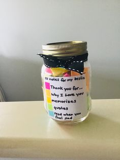 a jar filled with lots of colorful notes