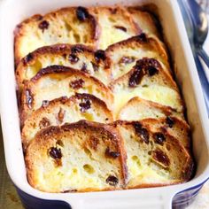 a casserole dish filled with bread and raisins