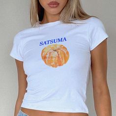 Satsuma 90s Baby Tee, T-shirt 90s Aesthetic Vintage Tee Trending Y2K Print Top * 90's Inspired baby tee style (made for adults) * 100% cotton * Easy tear-away label * Y2K Vintage Streetwear Trending Fashion * Environmentally sustainable made-to-order system The '90s-inspired baby features a soft, stretchy fabric, offering a snug, comfortable, and figure-flattering fit. Featuring a vibrant graphic print, this baby tee embodies the playful and youthful style of the 90's and Y2K eras. Ideal for pai Y2k Letter Print Tops For Streetwear, Y2k Style Letter Print Tops For Streetwear, Y2k Letter Print Streetwear Top, Y2k Streetwear Tops With Letter Print, Y2k Streetwear Top With Letter Print, Y2k Style T-shirt For Spring Streetwear, Y2k Streetwear T-shirt For Spring, Y2k Style Graphic T-shirt For Spring, Spring Y2k T-shirt With Graphic Design