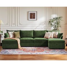 This 130.5-inch wide green sectional sofa combines a solid wood frame with luxurious chenille upholstery, bringing both modern style and functionality to your home. Designed as a modular sectional, it comfortably seats 6-8 people with medium-firm foam cushions supported by sinuous springs for lasting comfort. The fully movable ottomans provide ample storage space and allow you to configure the sofa as a sectional couch in either a U-shaped Section or L-shaped couch layout, adapting perfectly to your space. Foam-filled back cushions with removable covers make maintenance easy, and the armrests come with two accent pillows for added comfort and style. Whether for entertaining or relaxing, this green sectional is a versatile and stylish choice for any home. Latitude Run® Body Fabric: Green Ch Green Sectional Sofa, Couch Layout, Velvet Green Couch, Emerald Green Couch, Modular Sofa Living Room, 6 Seater Sofa, Modular Couches, Sectional Living Room Decor, Green Sectional