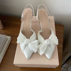 Loeffler Randall Sylvana Pearl White Heels - Perfect For Bride - Sold Out On Anthropologie Only Worn Once For My Rehearsal Size 9. A Voluminous Bow Detail Tops Off These Bridal Slingbacks With A Sleek, Pointed Silhouette. Slip-On Styling Polyester Upper; Leather Sole 3" Heel Imported Elegant White Slingback Pumps With Bow, White Heels With Bow For Events, White Open Heel Heels With Bow, White Heels With Bow And Open Heel, Elegant Wedding Shoes With Bow, White Closed Toe Feminine Heels, Chic Wedding Heels With Wrapped Heel, Chic White Wedding Shoes With Bow, Chic White Slingback Pumps With Bow