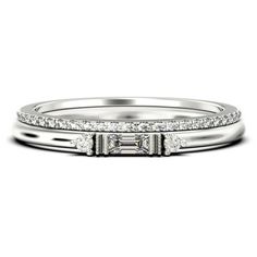 a white gold wedding ring set with princess cut diamonds on the side and baguetts