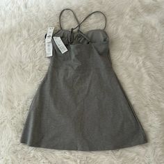 This Is A Brand New With Tags Gray Tennis Dress That Is Both Functional And Fashionable On The Court. I Am Moving To A Smaller Space So I Am Giving Away My Clothes. Casual Mini Dress With Built-in Bra, Casual Cotton Dress With Built-in Bra, Solid Mini Dress With Built-in Bra, Chic Sleeveless Workout Dress, Spring Workout Mini Dress With Built-in Bra, Mini Dress With Built-in Bra For Daywear, Mini Dresses With Built-in Bra, Solid Color Dresses With Built-in Bra For Daywear, Solid Dress With Built-in Bra For Daywear