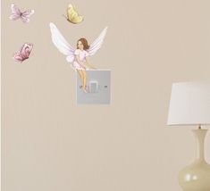 there is a light switch with some butterflies on the wall and one angel sitting on it