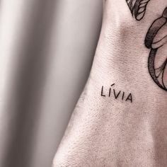 a close up of a person's foot with a tattoo on it that reads liva