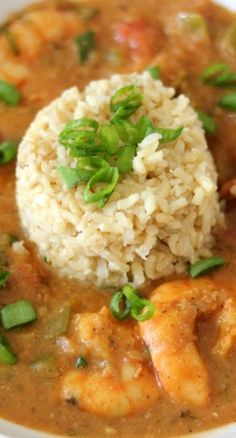 a white bowl filled with shrimp and rice