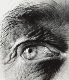 the eye of an old man with wrinkles