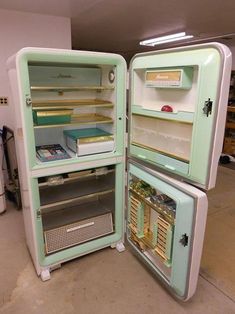 an old fashioned refrigerator with its door open