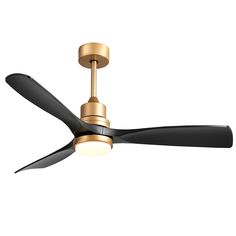 a gold ceiling fan with black blades and a light on the top, against a white background