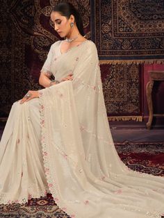 Introducing an exquisite off-white georgette saree that epitomizes elegance and grace, perfect for weddings, festivals, parties, and other special occasions. This beautiful saree is meticulously crafted from high-quality silk georgette fabric, combining the softness of silk with the lightweight and flowy texture of georgette. The off-white hue adds a touch of sophistication, making it a versatile addition to your ethnic wardrobe.
The saree is adorned with intricate sequin work, which shimmers de Full Coverage Outfit, White Georgette Saree, Organza Kurti, Indian Designer Dresses, Gorgeous Saree, Batik Print Dress, Dupion Silk Saree, Lehenga Crop Top, Mirror Embroidery