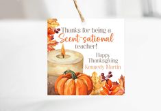 a card with a candle and pumpkins hanging from a string that says thanks for being a great - national teacher