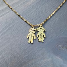 This necklace is a wonderful gift for both wife's mom and grandmother.Necklace can be ordered with multiple personalized boy or girl charms depending on your choice. And then you can engrave each child's charm with the name of the child it represents! It's easy to personalize it with a boy, girl or both pendant, just choose up to five pendants and add the names or important words for mom.This is a perfect necklace for moms everywhere! About Custom: 1. Select the color/ placement. Engraving can b Words For Mom, Grandmother Necklace, Name Pendant, Wife Gift, Engraved Necklace, Girls Jewelry, Grandma Gifts, Boy Girl, A Boy