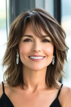 Save this pin for the best medium-length hairstyles for women over 50 with bangs. This choppy layered lob with bangs delivers a stylish, contemporary energy. The uneven layers bring texture to the forefront, giving your hair a vibrant, tousled effect. Messy Hair Medium Length, Medium Layered Haircuts For Me, Medium Hairstyles With Bangs For Women Over 50, Shoulder Length Side Bangs, Martha Stewart Hairstyles, Long Layered Medium Hair, Medium Length Haircut For 40 Year Old, Haircuts With Short Layers, Brunette Medium Haircut