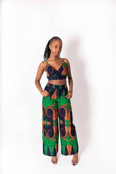 This Kimmy African print co-ord is the perfect fit for the summer. Made from 100%cotton fabric and stitched to excellent quality.  Why not pair it up with some tan summer sandals for the perfect day look. Alternatively white sandal heels for a chic evening look. Features: - 100% cotton fabric  - wax cotton print  - elasticated waist  - matching top included  Model 1 wears size 8 UK Model 2 wears size 18 UK Care Instructions: Handwash or dryclean only  Do not bleach Hang to dry Multicolor Two-piece Pant Set For Summer, Cotton Printed Pants For Vacation, Summer Cotton Sets With Long Pants, Cotton Long Pants Set For Summer, Printed Sleeveless Loungewear Sets, Sleeveless Printed Sets For Loungewear, Fitted Cotton Pants For Vacation, Casual Printed Cotton Sets, Spring Matching Set Cotton Pants