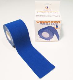 a roll of blue tape sitting on top of a white table