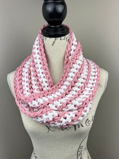 Handmade crochet infinity scarf  Yarn is 100% acrylic  Colors: soft rose, white striped (I)  Width is 5 inches  Length is 60 inches  Care Instructions: hand wash and lay flat to dry White Crochet Scarf One Size, White Hand Knitted Scarf One Size, White Hand Knitted Scarf, Pink Crochet Scarves, Handmade White Scarves For Spring, White Crochet Scarf, Scarf Chunky, Scarf Yarn, Crochet Infinity Scarf