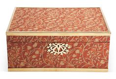 an ornate wooden box with carved designs on it