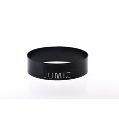 a black rubber bracelet with the word simu on it's front and side