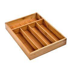 an empty wooden tray with compartments on it