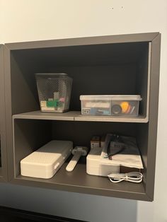 a shelf with some containers and other items on it