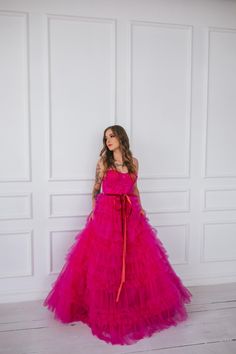 This hot pink princess dress will make you feel like you stepped straight out of a fairy tale. With its floor length and voluminous design,  it's perfect for any romantic occasion, from weddings to proms.  The small velvet belt and bow ties add unique and beautiful touches,  making you look and feel majestic.  (No awkward pumpkin coach rides here.) Message me for any kind of customizations. Pink Princess Ball Gown For Quinceanera, Princess Style Quinceanera Dress With Ruffles For Party, Princess Style Bridesmaid Dress For Prom Season, Princess Style Bridesmaid Ball Gown Wedding Dress, Princess Style Bridesmaid Wedding Dress For Prom Season, Organza Princess Dress With Ruffles For Prom, Pink Princess Style Quinceanera Dress, Prom Princess Dress With Ruffles, Pink Princess Dress For Quinceanera