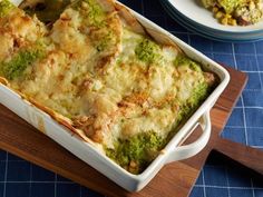 a casserole dish with broccoli and cheese