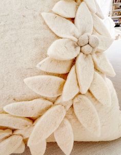 a white pillow with flowers on it