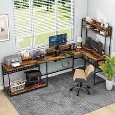 a computer desk sitting on top of a rug in a living room next to a window