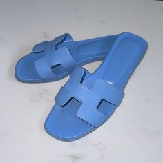 Authentic Hermes H Oran Sandals. Size 37. Comes With Box, Ribbon, And Dust Bags! Make An Offer Blue Flat Sandals For Formal Occasions, Box Ribbon, Hermes Shoes, Hermes Oran, Blue Sandals, Women's Shoes Sandals, Shoes Sandals, Dust Bag, Ribbon