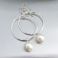 "White Freshwater Pearl Earrings~ These elegant sterling silver hoop earrings with a freshwater white pearl will look great for any occasion. Hammered and polished to a beautiful shine. Choose hoop size 1\" or 1.5\" Also available in 14k gold fill~ https://www.etsy.com/listing/199753367/white-pearl-hoop-earrings-small-gold?ref=shop_home_active_4 Also available with peacock pearls~ https://www.etsy.com/listing/269037112/peacock-pearl-earrings-freshwater-pearls?ref=listing-shop-header-0 Shop~bhttp Delicate Silver Hoop Earrings For Anniversary, Delicate Round Sterling Silver Pearl Earrings, Delicate Sterling Silver Round Pearl Earrings, Sterling Silver Hoop Earrings With Pearl Drop For Anniversary, Silver Small Hoop Pearl Earrings For Anniversary, Nickel-free White Hoop Pearl Earrings, Classic Sterling Silver Hoop Earrings For Wedding, Delicate Sterling Silver Hoop Earrings With Pearl Drop, Sterling Silver Small Hoop Pearl Earrings For Anniversary