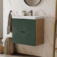 a bathroom with marble walls and flooring, including a green cabinet next to a mirror