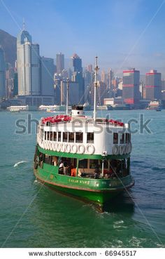 a ferry boat on the water in hong