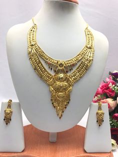 "Handmade Indian Bridal Wedding Jewelry 22ct Heavy Gold Plated Necklace Set with Earrings Indian Jewelry Indian Bollywood Jewelry , its Artificial Jewelry  Type :22ct Gold Plated Necklace Set Earrings Length: 2.5\"inches Approx Shape - As Shown in Picture It is a perfect match with formal attire on special occasions or with casual wearing The item will come with the clear plastic box or plastic bag and packaging Traditional Indian Wedding Jewellery Slight Colour variations possible due to differ Traditional Dual-tone Gold Jewelry Sets, Bollywood Style Dual-tone Gold Jewelry Sets, Gold Kundan Necklace With Meenakari For Anniversary, Gold Dual-tone Jewelry For Wedding, 22k Gold Dual-tone Jewelry For Wedding, Gold Dual-tone Wedding Jewelry, Dual-tone Gold Wedding Jewelry, Dual-tone 22k Gold Wedding Jewelry, Gold Dual-tone Kundan Necklace For Wedding