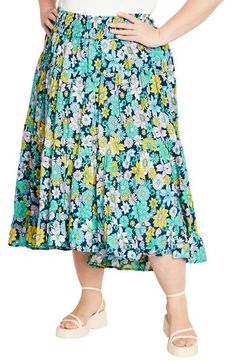 A captivating print and ankle-grazing hem add eye-catching elements to a flowy skirt fitted with a smocked waist for comfortable wear. 38 1/2" length Smocked waist 100% viscose Machine wash, line dry Imported Spring Maxi Skirt With Elastic Waistband For Daywear, Floral Print Flowy Skirt, Beach Skirted Rayon Bottoms, Spring Rayon Maxi Skirt With Gathered Details, Spring Tiered Maxi Skirt In Rayon, Beach Midi-length Gathered Skirt, Vacation Midi Length Gathered Skirt, Midi Length Gathered Skirt For Beach, Spring Midi Bottoms With Ruffle Hem