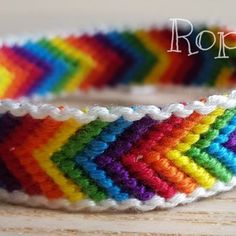 a close up of a colorful bracelet on a table