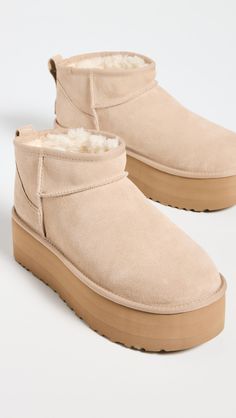 Cannot be shipped outside the USAUpper: CowhidePull tabsDebossed logo patchRound toeEVA soleImported, VietnamThis item cannot be gift-boxedStyle #UGGGG30289 Uggs Ultra Mini, Shoes Png, Pink Uggs, Ugg Classic Ultra Mini, Preppy Christmas, Ugg Mini, Cute Slippers, Debossed Logo, Cream Shoes