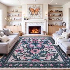 a living room filled with furniture and a large rug on the floor in front of a fire place