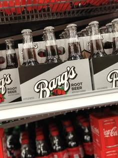 bottles of bud's root beer on display in a store