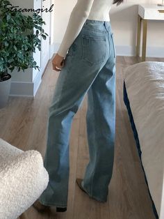 Style: Long Wide Leg Ripped Denim PantsJeans Style: StraightLength: LongClosure Type: Zipper FlyWaist Type: MidThickness: RegularWash: MediumFit Type: Loose FitElasticity: No Detail: Ripped, Scratched Material: CottonMaterial: Polyester