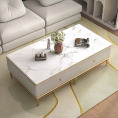 a living room with white couches and a marble coffee table