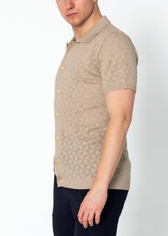 Introducing our Geometric Crochet Knit Polo, a sophisticated and stylish addition to your wardrobe. Crafted from high-quality crochet knit fabric, this polo shirt features a unique geometric pattern that adds a touch of modern flair. The crochet knit construction provides breathability and texture, making it ideal for warmer weather. The polo collar adds a classic touch, while the short sleeves offer comfort and versatility. With its tailored fit and attention to detail, this polo shirt is perfe Jacquard Knit Collared Top, Collared Jacquard Knit Top, Fitted Jacquard Knit Polo Collar Top, Fitted Jacquard Knit Polo Top, Fitted Jacquard Knit Top With Polo Collar, Summer Knit Polo Sweater, Fitted Jacquard Knit Collared Top, Fitted Collared Pointelle Knit Tops, Fitted Polo Sweater With Textured Knit And Short Sleeves