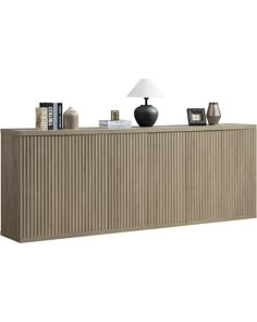 the sideboard is made out of wood and has a lamp on top